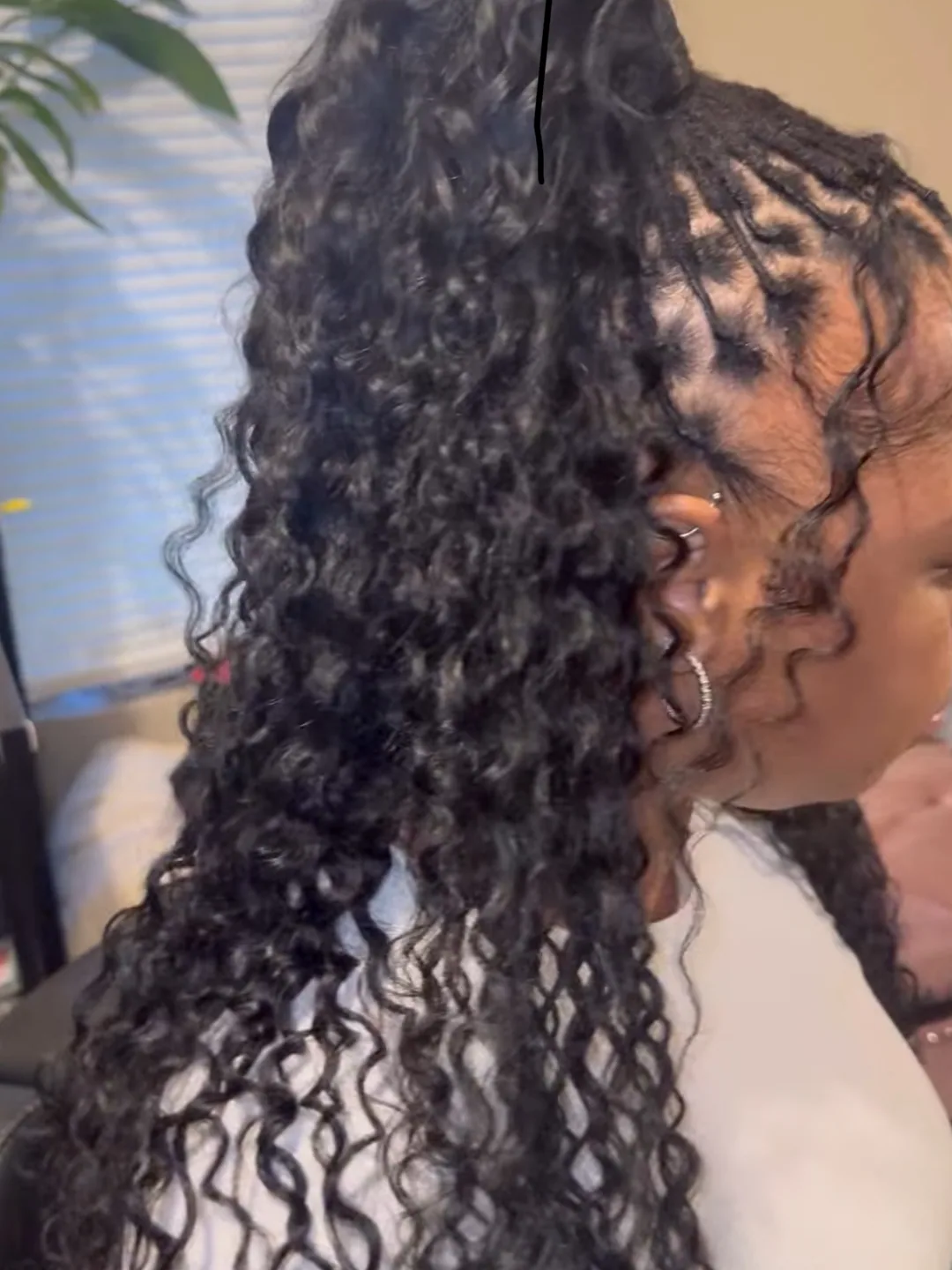 Loc ponytail with boho curls