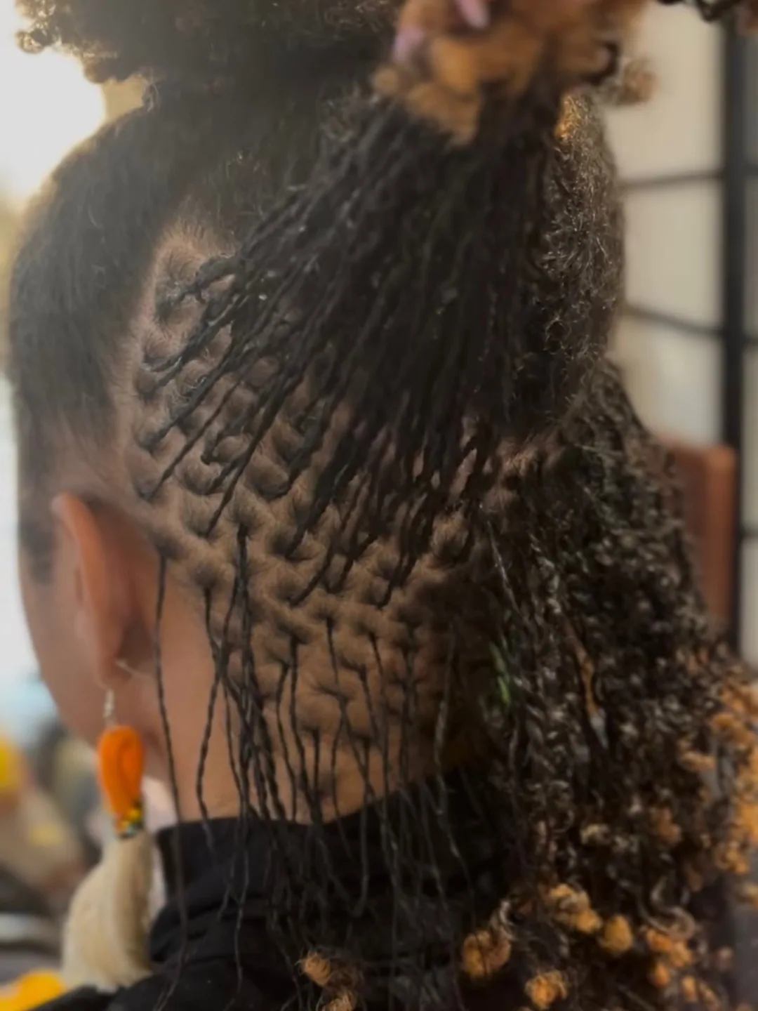 Intricate parting and curls